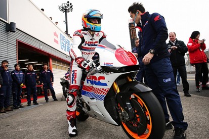 McLaren F1 driver Fernando Alonso tries Honda MotoGP bike at Motegi