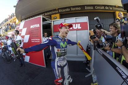 Valencia MotoGP: Lorenzo beats Marquez to win and Rossi to title
