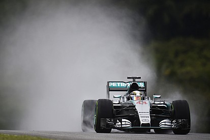 Rainy qualifying in Sepang with Hamilton in pole and Rosberg in third