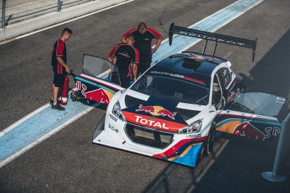 Sebastien Loeb receives his Pikes Peak Peugeot 208T16