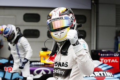 Malaysian GP: Lewis Hamilton resists Sebastian Vettel for wet pole