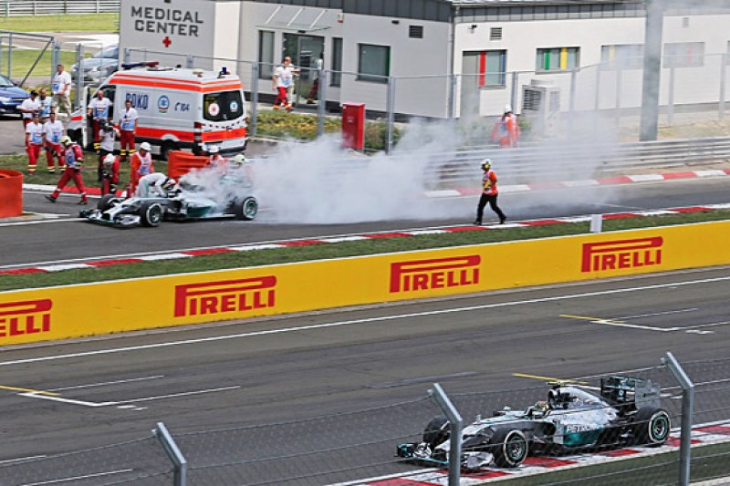 Hungarian GP: Rosberg on pole, fire puts Hamilton out in Q1