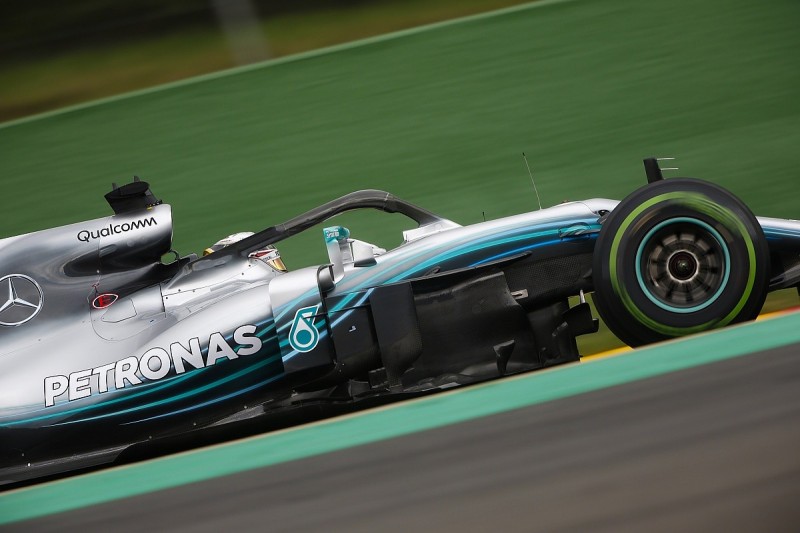Belgian GP: Hamilton beats F1 title rival Vettel to pole in wet Q3