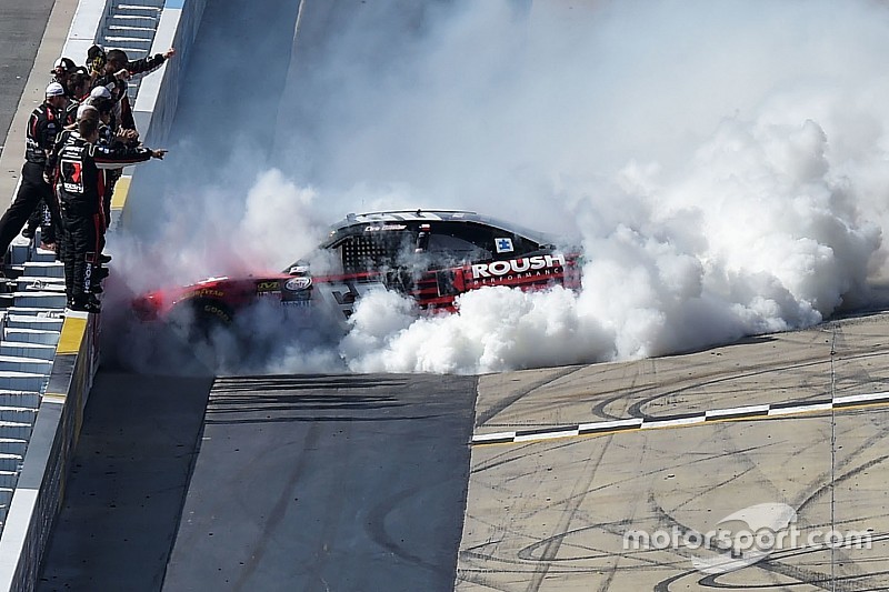 Buescher pushes past teammate to take Dover victory