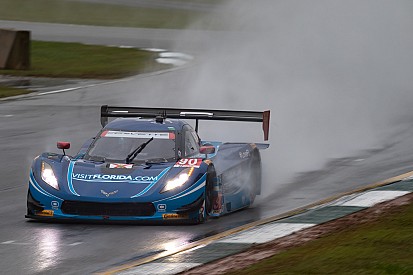 Soggy Petit takes dripping-wet green flag