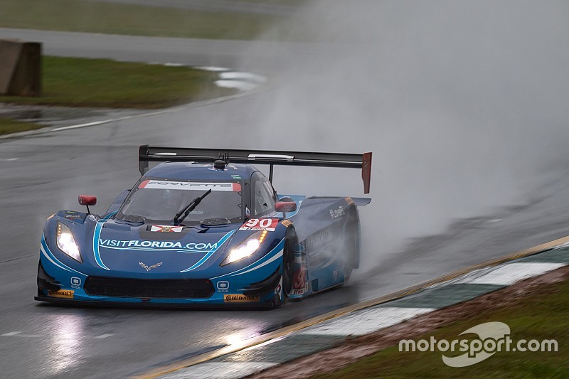Soggy Petit takes dripping-wet green flag