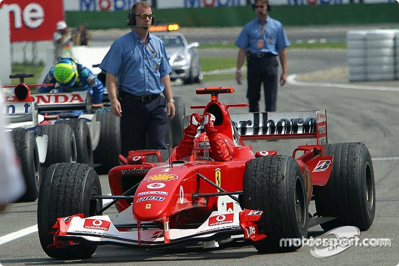 Race winner Michael Schumacher arrives in Parc Fermé