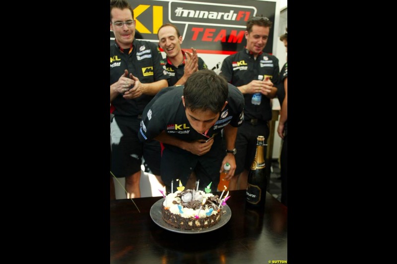 The Minardi team celebrates Alex Yoong's 26th birthday. Saturday, French Grand Prix, Magny Cours, France, July 20th 2002.