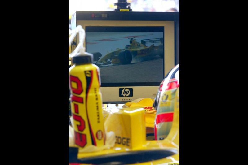Jordan's Takuma Sato watches teammate Giancarlo Fisichella crash. Saturday Free Practice, French Grand Prix, Magny Cours, France, July 20th 2002.