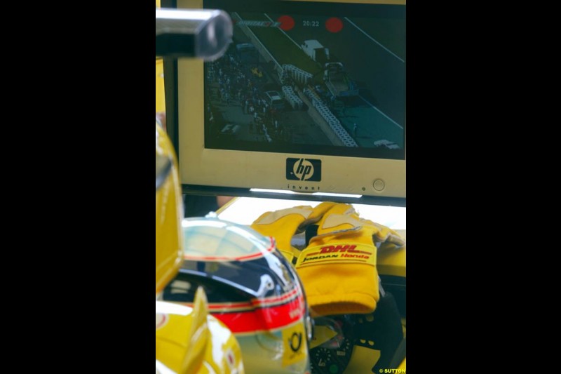 Jordan's Takuma Sato watches teammate Giancarlo Fisichella crash. Saturday Free Practice, French Grand Prix, Magny Cours, France, July 20th 2002.