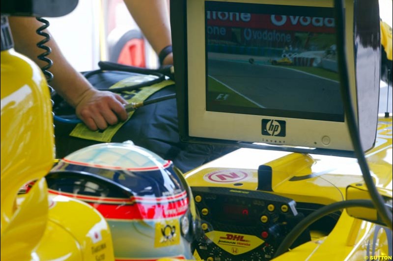 Jordan's Takuma Sato watches teammate Giancarlo Fisichella crash. Saturday Free Practice, French Grand Prix, Magny Cours, France, July 20th 2002.