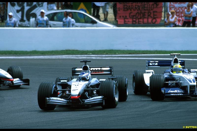 Kimi Raikkonen, McLaren and Ralf Schumacher, Williams BMW FW24, fight for position. French Grand Prix, Magny Cours, France, July 21st 2002.