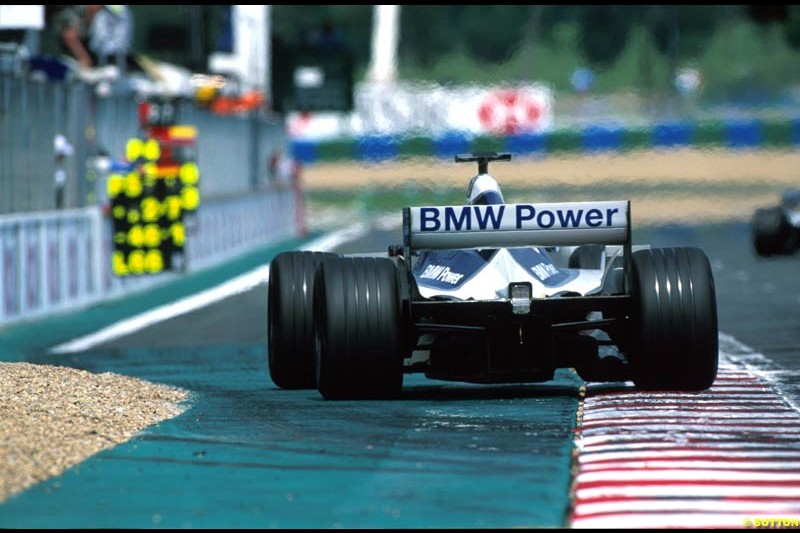 A Williams BMW FW24 crosses the start/finish line. French Grand Prix, Magny Cours, France, July 21st 2002.