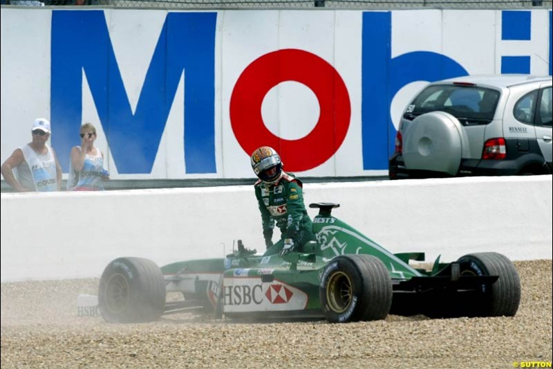 Eddie Irvine, Jaguar, retires from the French Grand Prix, Magny Cours, France, July 21st 2002. 