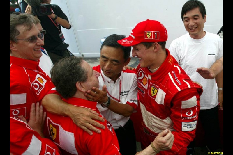 The Ferrari team and Bridestone president celebrate Michael Schumacher's 5th WC. French Grand Prix, Magny Cours, France, July 21st 2002.
