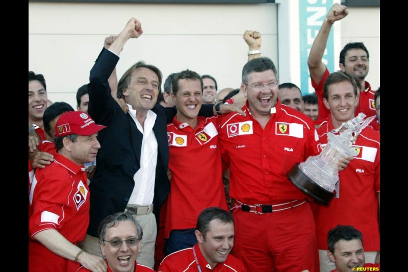 The entire Ferrari team, led by president Luca di Montezemolo, celebrate Michael Schumacher's 5th WC. French Grand Prix, Magny Cours, France, July 21st 2002.