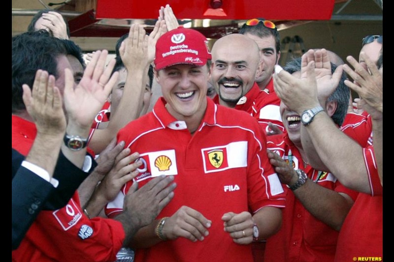 The entire Ferrari team, led by president Luca di Montezemolo, celebrate Michael Schumacher's 5th WC. French Grand Prix, Magny Cours, France, July 21st 2002.