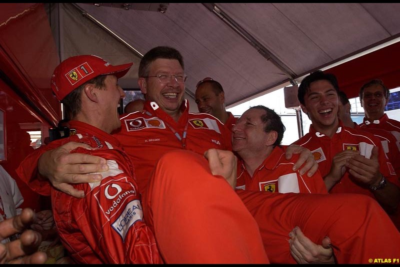 The entire Ferrari team celebrate Michael Schumacher's 5th WC. French Grand Prix, Magny Cours, France, July 21st 2002.