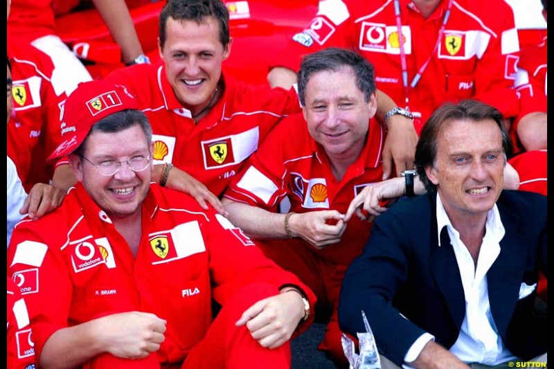 The entire Ferrari team, led by president Luca di Montezemolo, celebrate Michael Schumacher's 5th WC. French Grand Prix, Magny Cours, France, July 21st 2002.