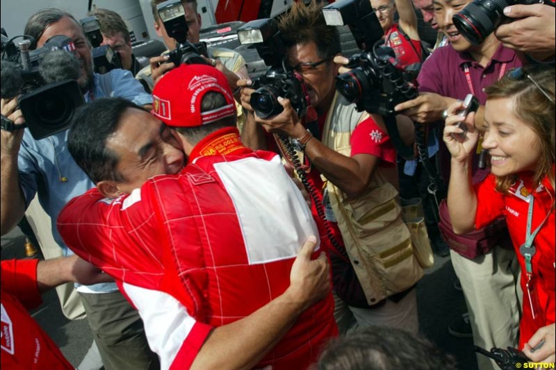 Bridgestone president celebrates with Michael Schumacher. French Grand Prix, Magny Cours, France, July 21st 2002.