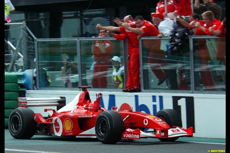 Michael Schumacher, Ferrari, secures his 5th World Championship with a win at the French Grand Prix, Magny Cours, France, July 21st 2002. 
