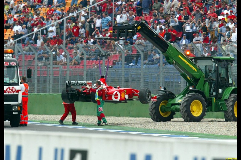 Rubens Barrichello's Ferrari is lifted from the track after a spin during Saturday Free Practice. German Grand Prix, Hockenheim, Germany, July 27th 2002.