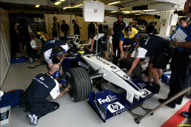 Ralf Schumacher (GER) Williams BMW FW24 in the pits. Hungarian Grand Prix, Budapest, 16 August 2002.