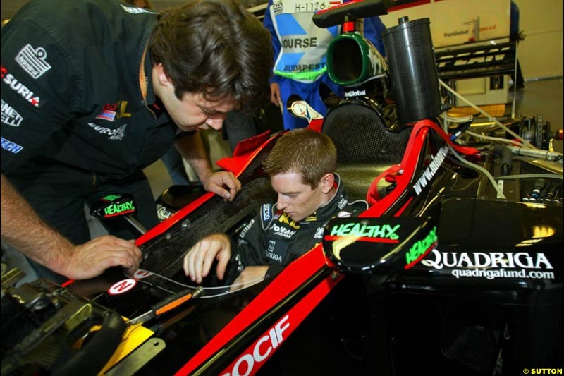 Minardi new comer Anthony Davidson sits in the Minardi cockpit. Hungarian Grand Prix, Budapest, Hungary, August 15th 2002.