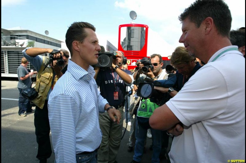 Michael Schumacher, Ferrari, talks to the press. Hungarian Grand Prix, Budapest, Hungary, August 15th 2002.