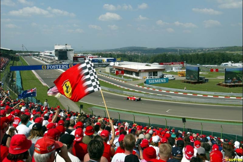 The fans watch Michael Schumacher, Ferrari, during Qualifying, Hungarian Grand Prix, Budapest, August 17 2002.