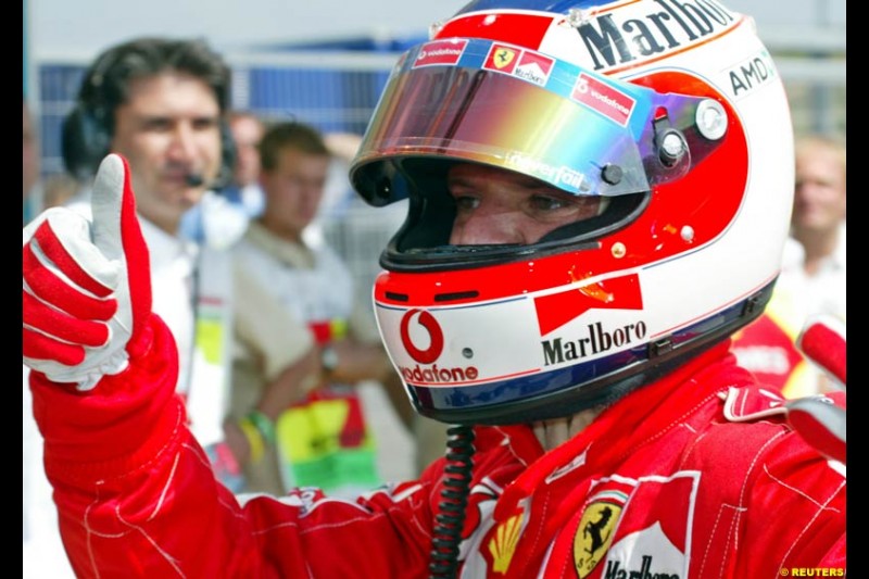 Rubens Barrichello, Ferrari, celebrates his third pole of the season. Hungarian Grand Prix, Budapest, August 17 2002.