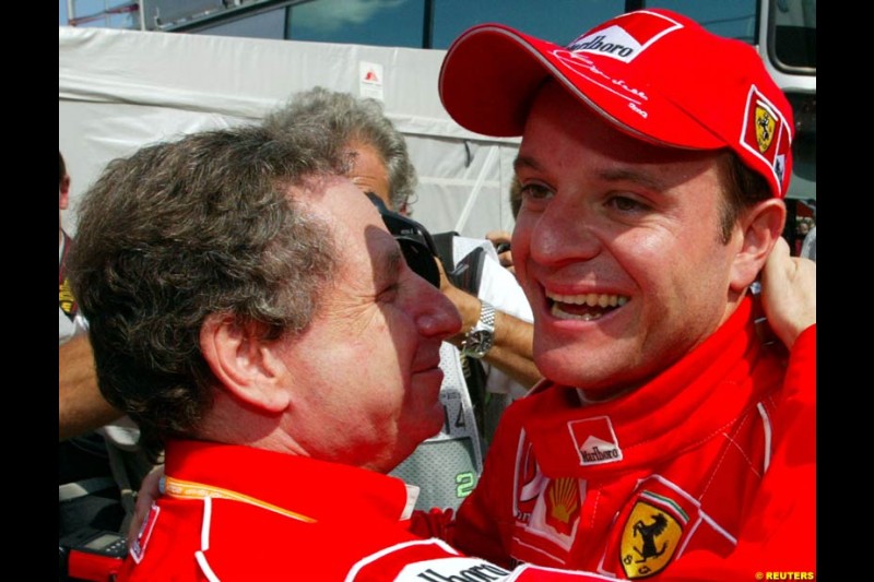 Rubens Barrichello, Ferrari, celebrates his third pole of the season with Ferrari Director Jean Todt. Hungarian Grand Prix, Budapest, August 17 2002.
