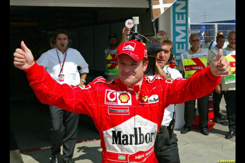 Rubens Barrichello, Ferrari, celebrates his third pole of the season. Hungarian Grand Prix, Budapest, August 17 2002.