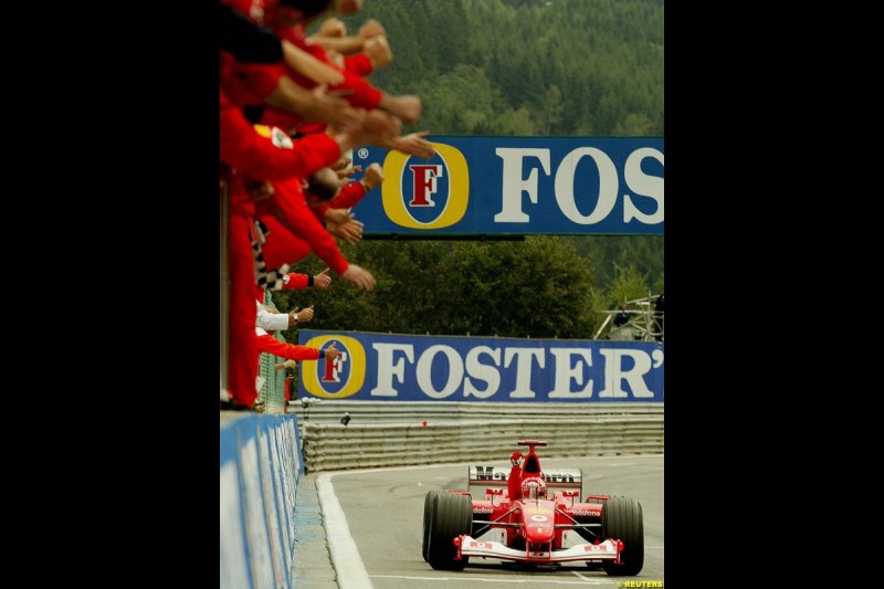 The Ferrari team celebrate. Belgian Grand Prix, Spa-Francorchamps, Belgium, September 1st 2002.