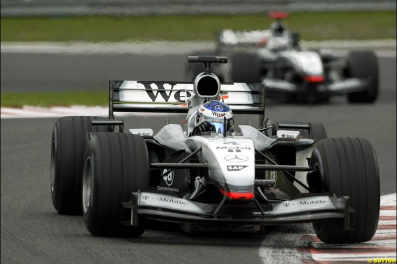 Kimi Raikkonen, McLaren, leads team mate David Coulthard. Belgian Grand Prix, Spa-Francorchamps, Belgium, September 1st 2002. 
