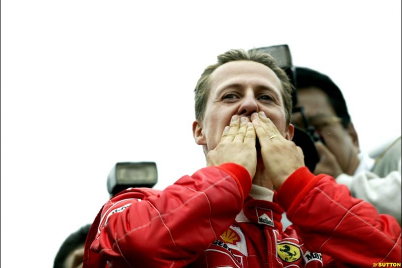 Michael Schumacher, Ferrari, celebrates victory. Belgian Grand Prix, Spa-Francorchamps, Belgium, September 1st 2002.