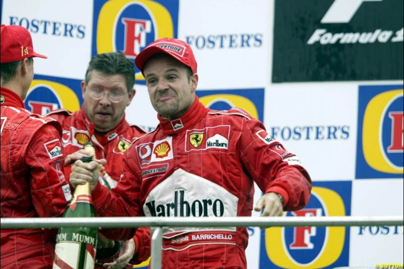 Michael Schumacher, Ross Brawn, and Rubens Barrichello of Ferrari celebrate. Belgian Grand Prix, Spa-Francorchamps, Belgium, September 1st 2002.