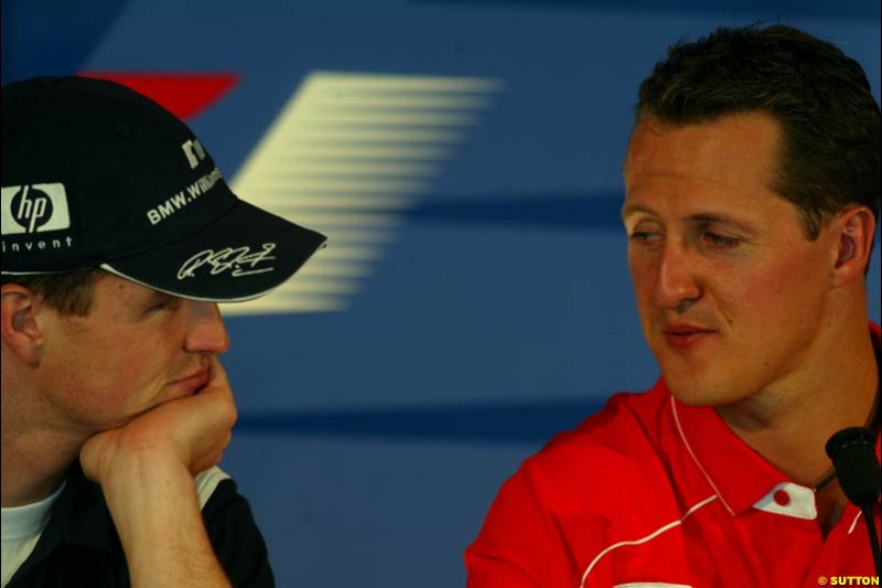 Ralf and Michael Schumacher at the FIA Friday's Press Conference. United States GP, Indianapolis, September 27th 2002.