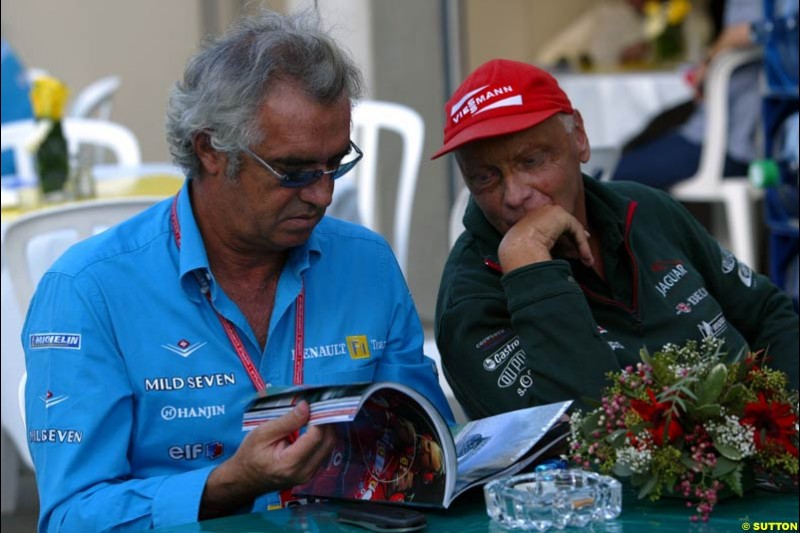 Flavio Briatore, Renault, and Niki Lauda, Jaguar. Friday Free Practice, United States GP, Indianapolis, September 27th 2002.