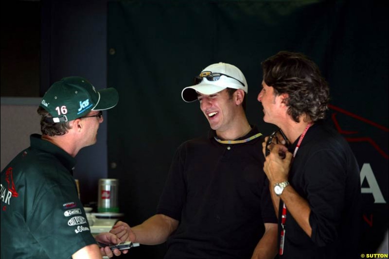 Eddie Irvine with Tomas Scheckter and their manager. Friday Free Practice, United States GP, Indianapolis, September 27th 2002.