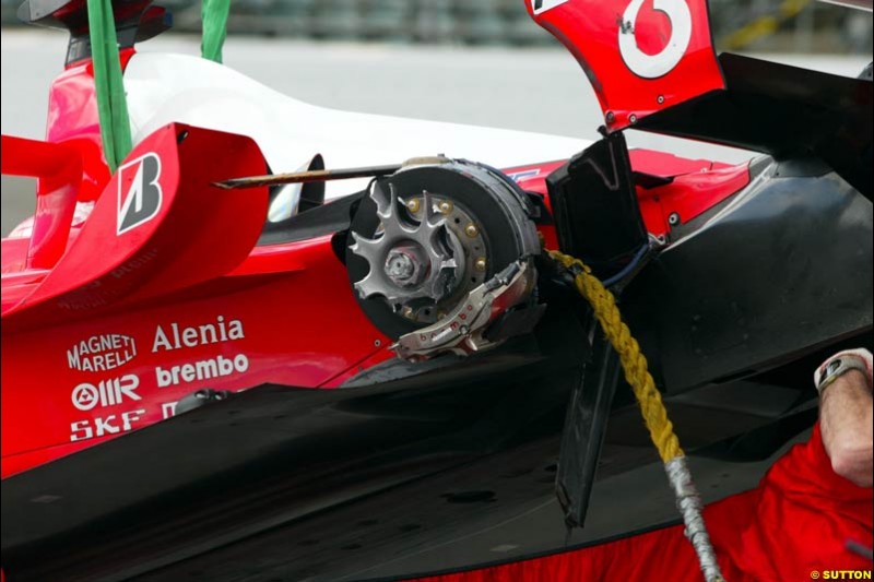 Rubens Barrichello's damaged Ferrari brought back to the pits. Friday Free Practice, United States GP, Indianapolis, September 27th 2002.