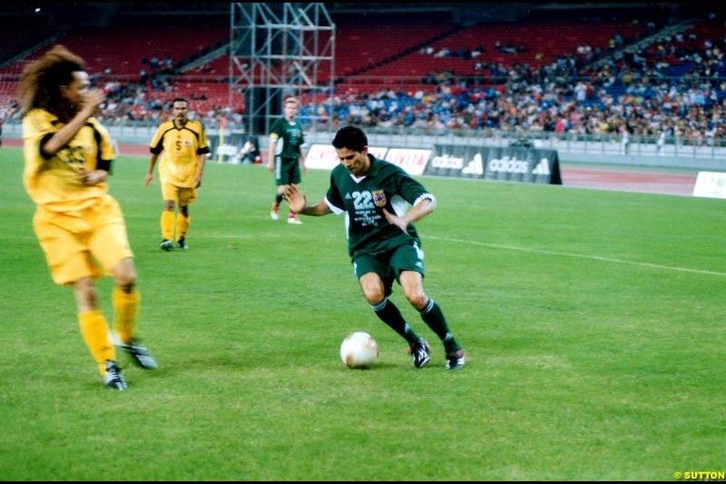 Alex Yoong takes part in a charity football match with Irish boy band Westlife. Malaysia, Kuala Lumpur, 30 October 2002.