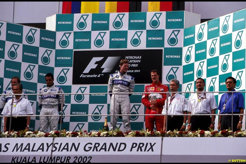 Malaysian Grand Prix, Round 9 Podium. 1-Ralf Schumacher, Williams. 2-Juan Pablo Montoya, Williams. 3-Michael Schumacher, Ferrari.