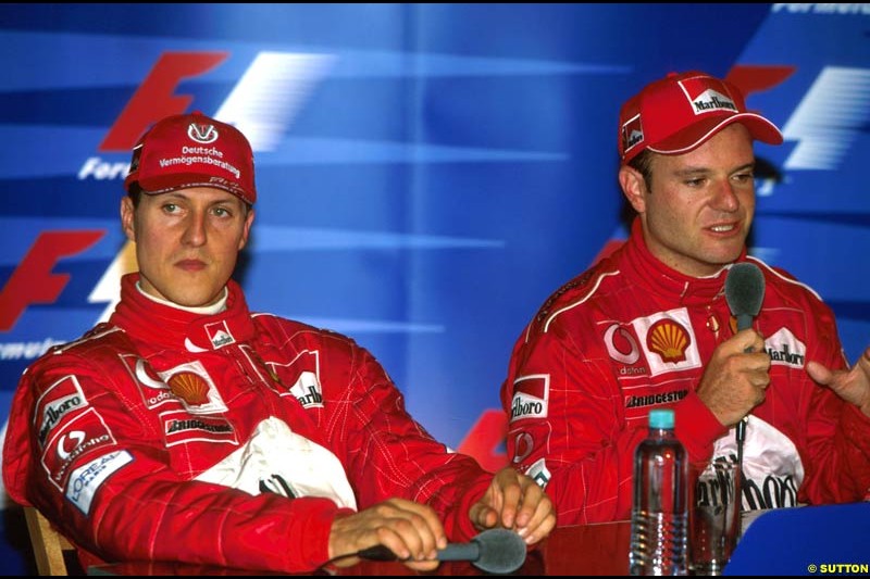 Michael Schumacher, Ferrari, sits next to Rubens Barrichello, Ferrari, after the Austrian Grand Prix, Round 6.