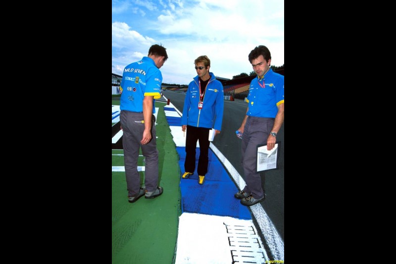 Renault team members inspect the new Hockenheim circuit. German Grand Prix, Round 12.