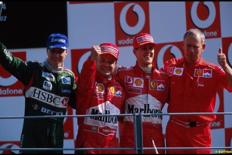 Italian Grand Prix, Round 15 Podium. 1-Michael Schumacher, Ferrari. 2-Rubens Barrichello, Ferrari. 3-Eddie Irvine, Jaguar.