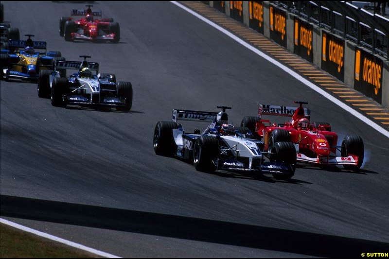 Juan Pablo Montoya, Williams, and Michael Schumacher, Ferrari, battle for the lead of the Brazilian Grand Prix, Round 3.