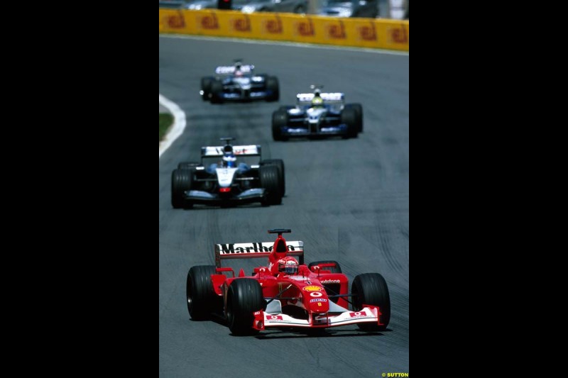 Michael Schumacher, Ferrari, leads Kimi Raikkonen, McLaren. Canadian Grand Prix, Round 8.