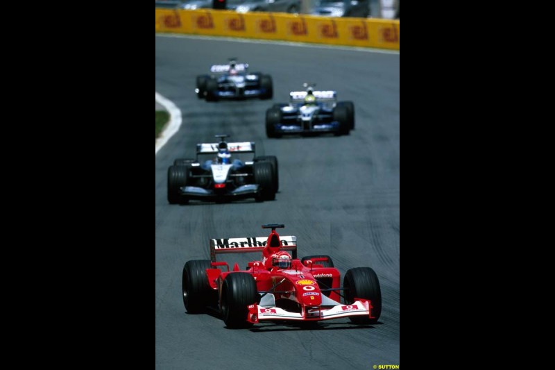 Michael Schumacher, Ferrari, leads Kimi Raikkonen, McLaren. Canadian Grand Prix, Round 8. 