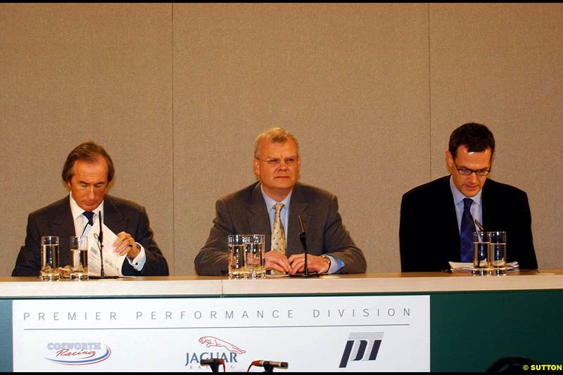 Sir Jackie Stewart, Richard Parry-Jones and Stuart Dyble at the Jaguar Media Briefing. London Landmark Hotel, England. November 26th 2002.